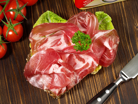 Bread with Ham Slices on wooden Background