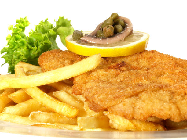 istock Breaded Schnitzel with French Fries - Isolated 1690517232