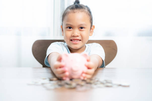 istock Young girl saving money at home 1690525250