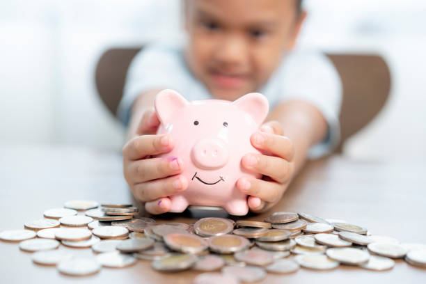 istock Young girl saving money at home 1690525251