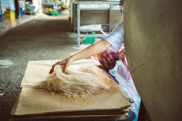 istock vietnamese woman sorting colorful rice noodles 1690563117