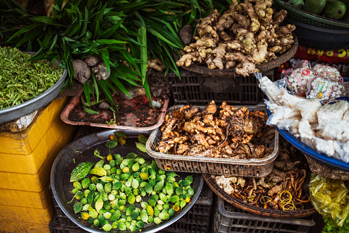 arrangement of fresh fruits and vegetables at farmers market in Vietnam