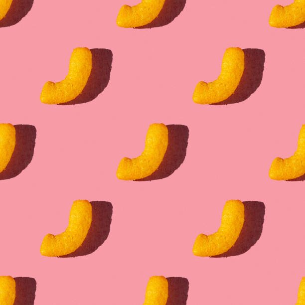 istock seamless pattern of corn sticks on a pink background with hard light 1690594071