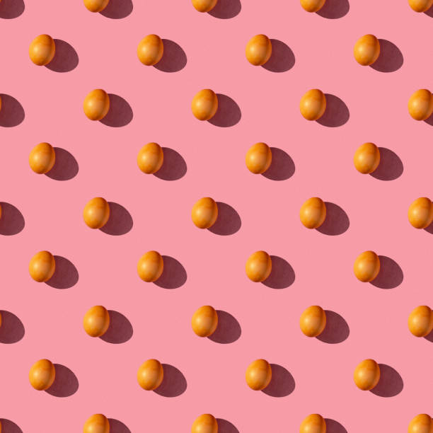 istock seamless pattern of eggs on a pink background with hard light 1690594332