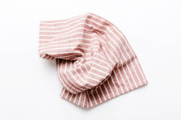 istock top view with red empty kitchen napkin isolated on table background. Folded cloth for mockup with copy space, Flat lay. Minimal style 1690597753