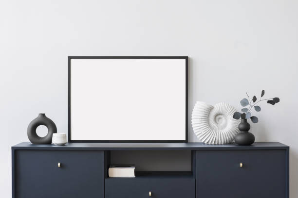 istock Artwork mockup in interior design. Blank picture frame on a wall. Horizontal orientation 1690602144