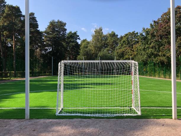 istock football field, gates in the foreground 1690624681