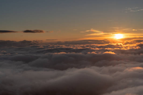 istock sunrise and sea of clouds 1690627635