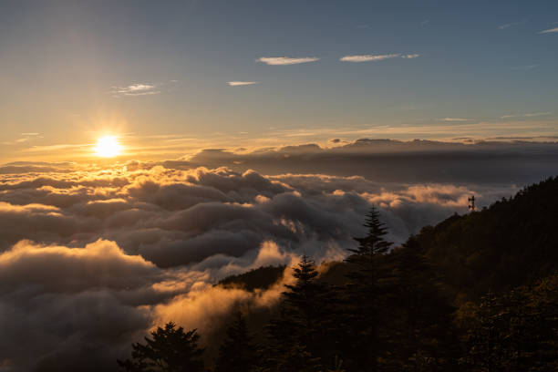 istock sunrise and sea of clouds 1690627856
