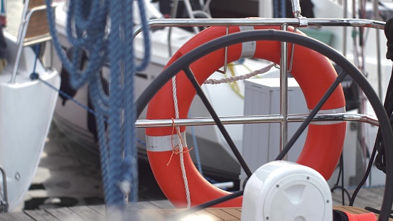 Lifebelt Ring on Sailing Yacht Moored in Marina Close-Up