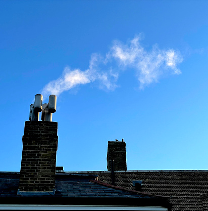 Gas boiler flue on a cold morning