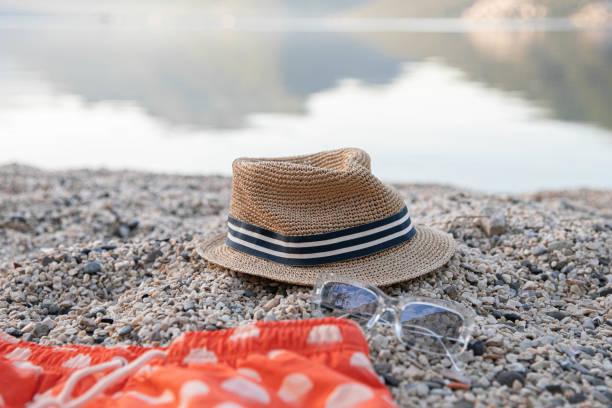 man's hat on the beach, close up