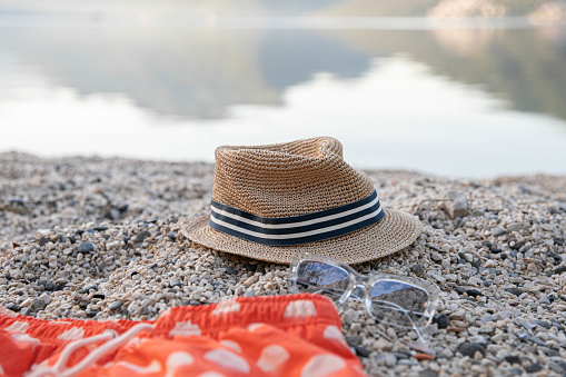 man's hat on the beach, close up