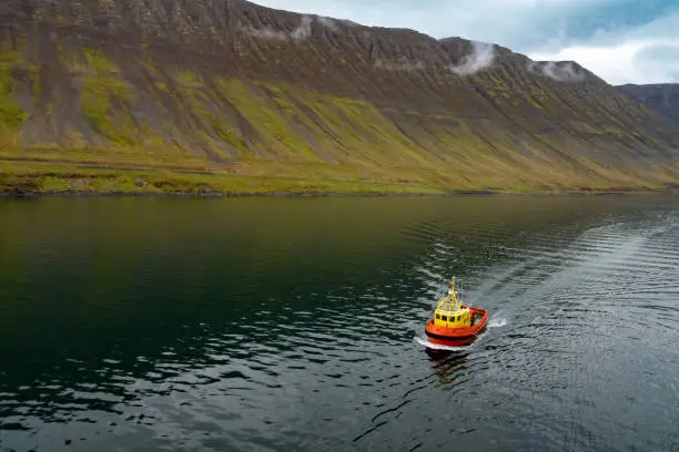 Photo of Tugboat near the harbor of ÃsafjÃ¶rÃ°ur (ice fjord, VestfirÃ°ir (Westfjords), northwest of Iceland.