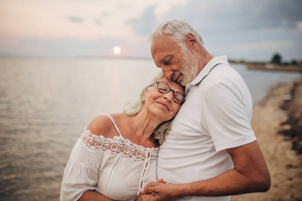 istock Happy senior couple by the sea 1690716976