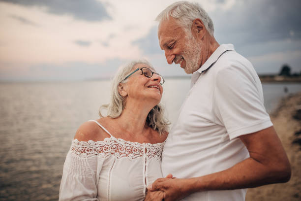 istock Happy senior couple by the sea 1690719113
