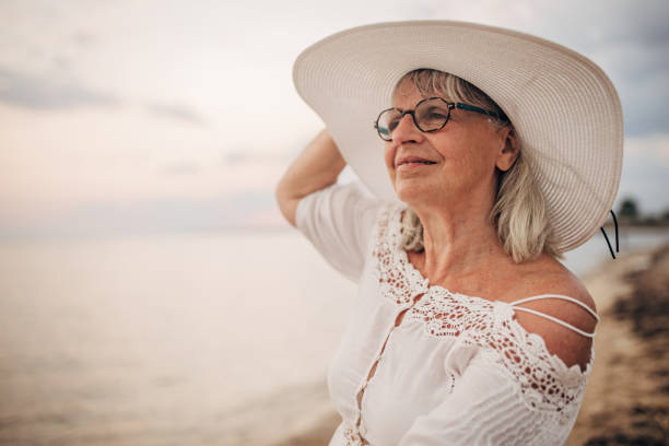 istock Charming old woman by the sea 1690739012