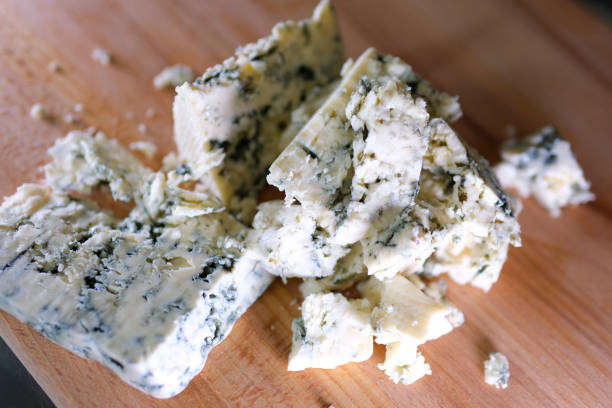 istock Rotation cheese on black slate plate. Delicious cheese Dorblu on the cutting board on background 1690770175