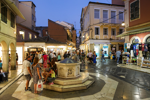 Crowd during night at Vrachlioti square in old town in Corfu, Greece.