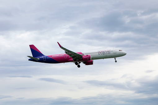 Airbus A321 plane flying from Corfu Airport, operated by Wizz Air, a Hungarian multinational ultra low-cost carrier.