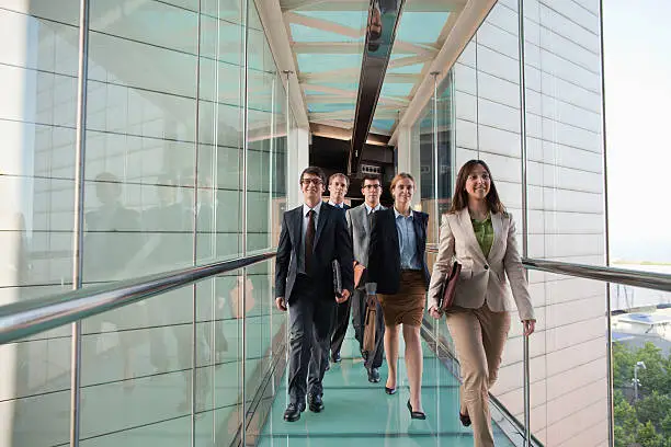 Photo of Business people walking together