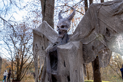Installation of a scary figure of demons in the park on Halloween day