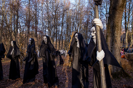 installation of figures of demon nuns on Halloween day in the park