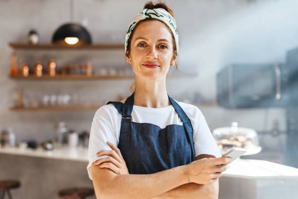 Hospitality worker using a mobile phone in a restaurant