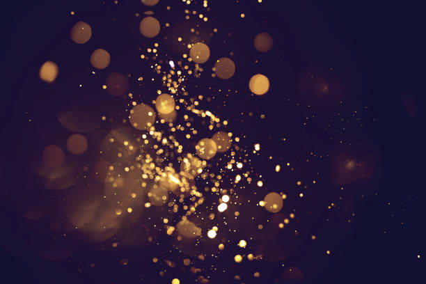 istock Golden abstract bokeh on black background. 1690812761