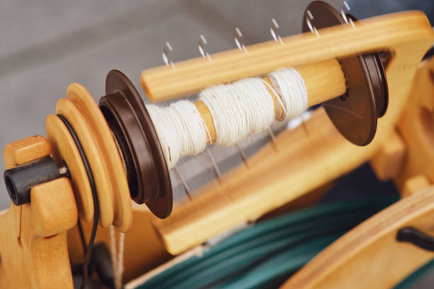 istock The hand-operated spindle is used for spinning thread. 1690815493