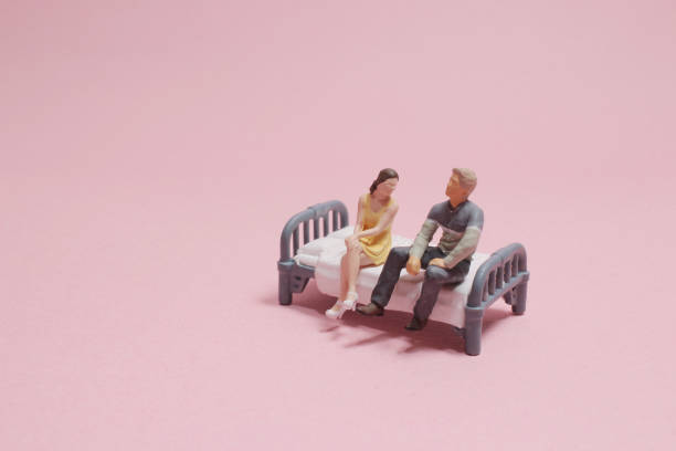 istock a mini of figure Couple in bed 1690831888