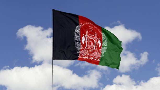 istock Afghanistan Flag is Waving Against in the Sky. 1690833143