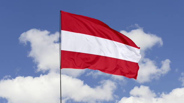 istock Austria Flag is Waving Against in the Sky. 1690833726