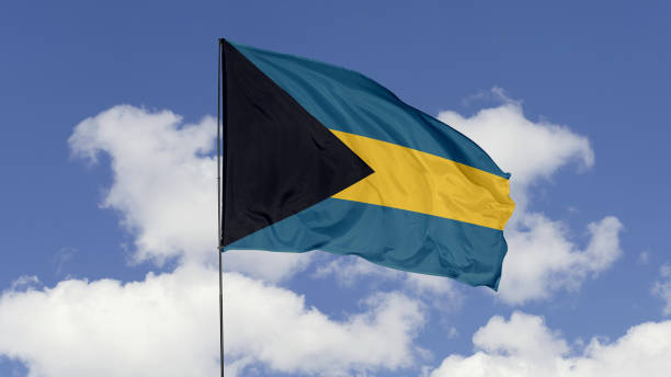 istock Bahamas Flag is Waving Against in the Sky. 1690833733
