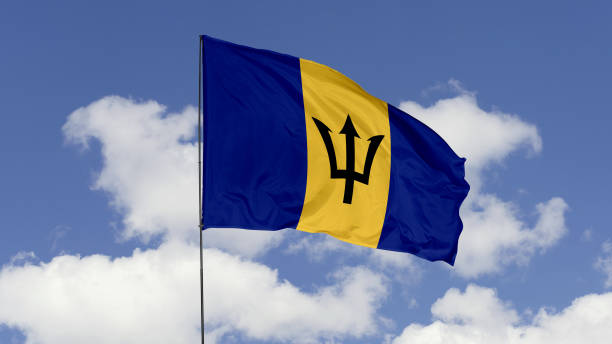 istock Barbados Flag is Waving Against in the Sky. 1690833890