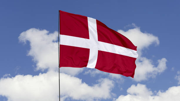 istock Denmark Flag is Waving Against in the Sky. 1690835439