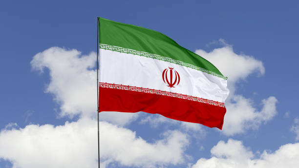 istock Iran Flag is Waving Against in the Sky. 1690837075