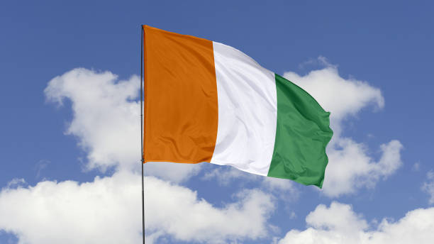 istock Ivory Coast Flag is Waving Against in the Sky. 1690837585