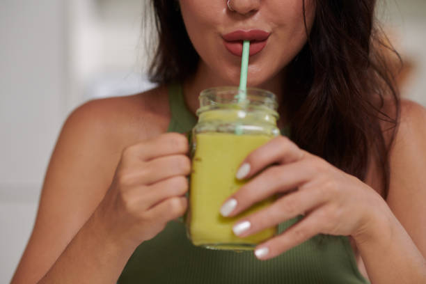 istock Woman Sipping Green Smoothie 1690843050