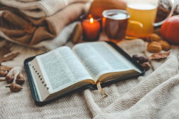istock Open bible in autumn interior, good morning 1690849311