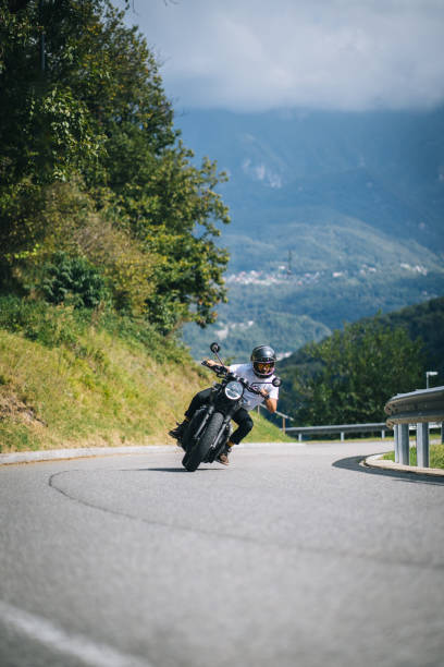 istock Motorcyclist rides mountain road 1690851870
