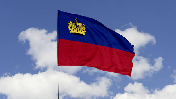 istock Liechtenstein Flag is Waving Against in the Sky. 1690856548