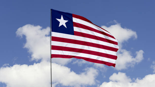 istock Liberia Flag is Waving Against in the Sky. 1690856552