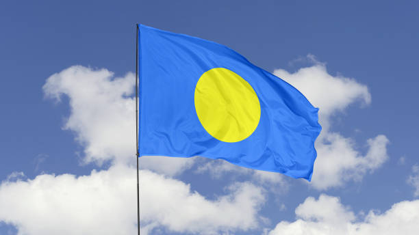 istock Palau Flag is Waving Against in the Sky. 1690858784