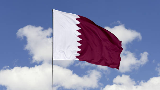 istock Qatar Flag is Waving Against in the Sky. 1690859315