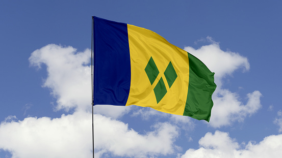 3d illustration flag of Saint Vincent and The Grenadines. Saint Vincent and The Grenadines flag isolated on the blue sky.