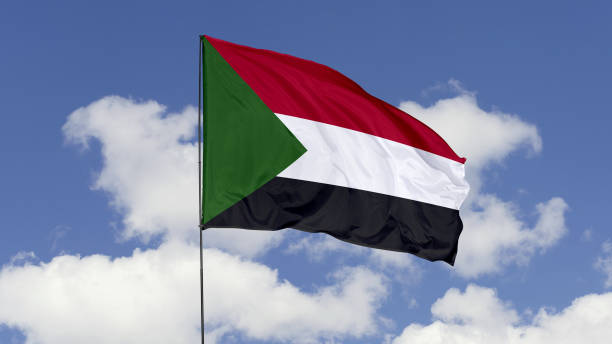 istock Sudan Flag is Waving Against in the Sky. 1690860423