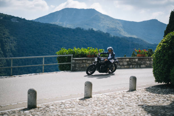 istock Motorcyclist rides mountain road 1690865529