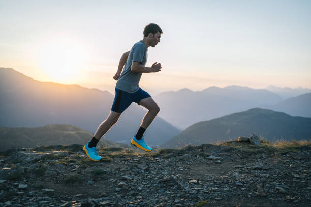 istock Trail runner bounds along mountain trail 1690868889
