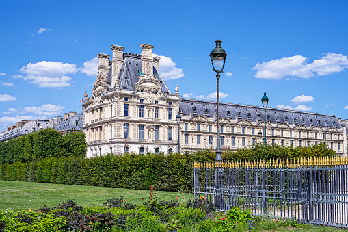 Paris : facade of a part of Louvre museum, view since the Tuileries garden. July 6, 2023.